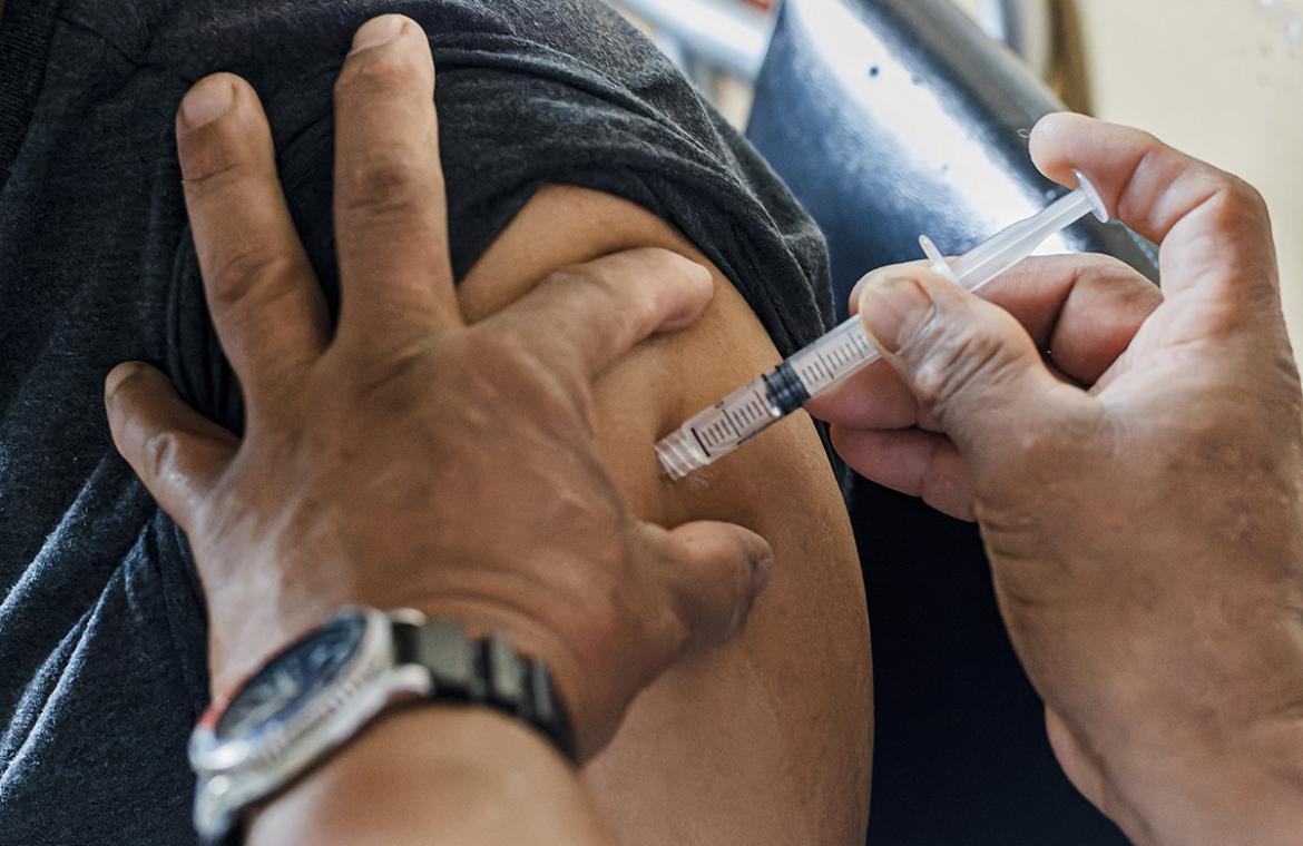 Extreme closeup shot of vaccine being delivered into arm