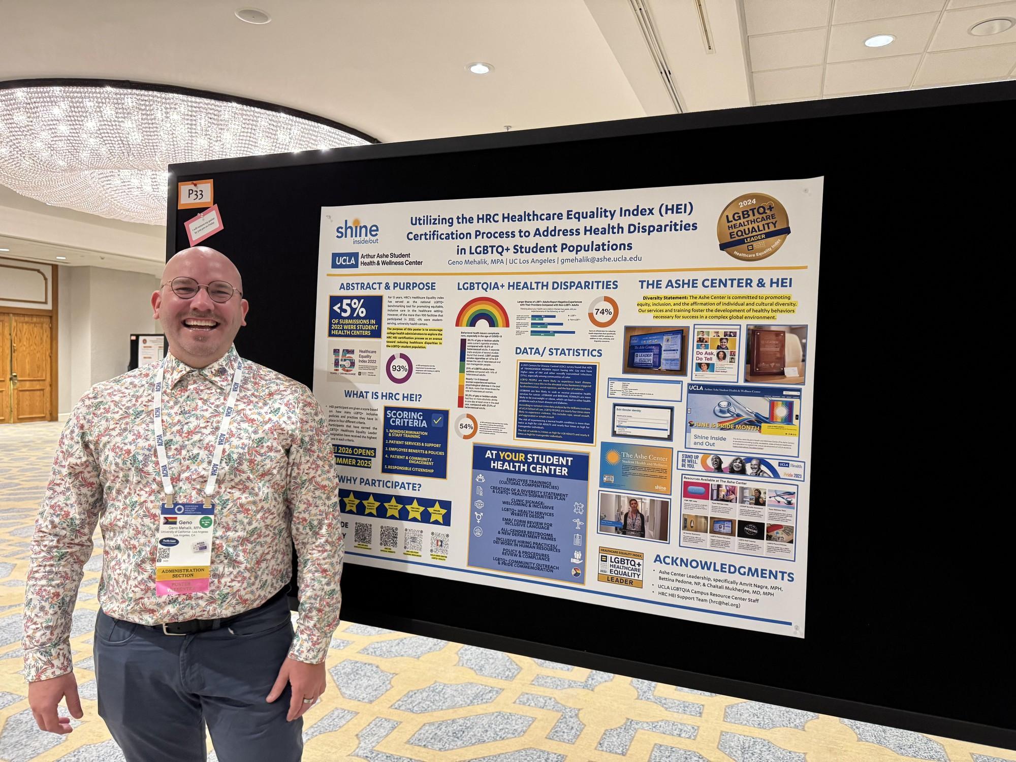 Geno Mehalik stands in front of ACHA conference poster on LGBTQ+ inclusive care