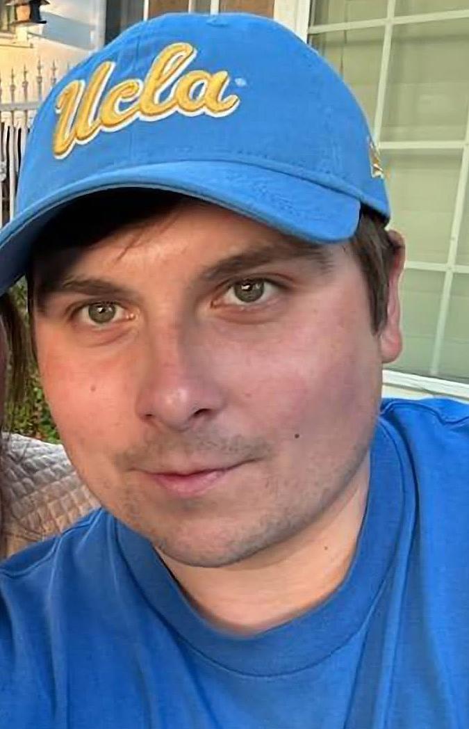 Close up on Bobby Schubert's face in UCLA hat