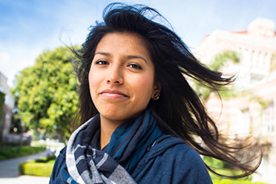 Close of Hispanic female student with hair waving in the wind