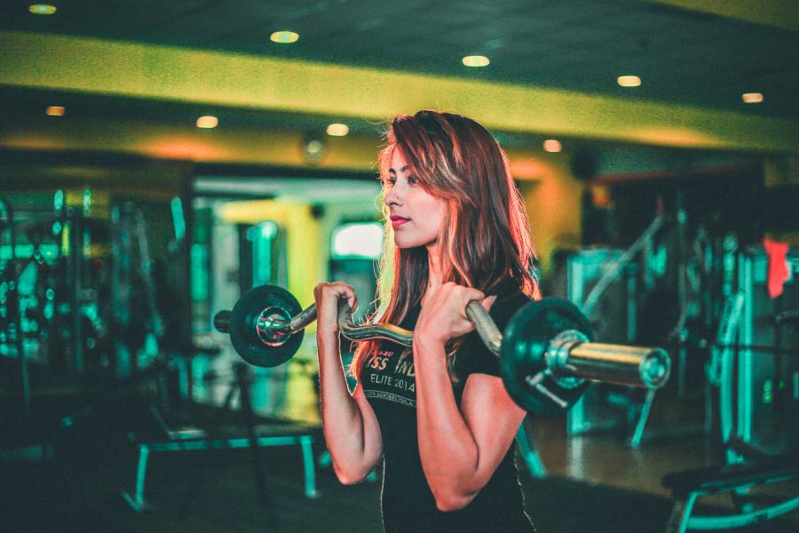 Student in the gym with weights