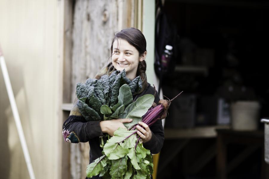 Student holding vegetables