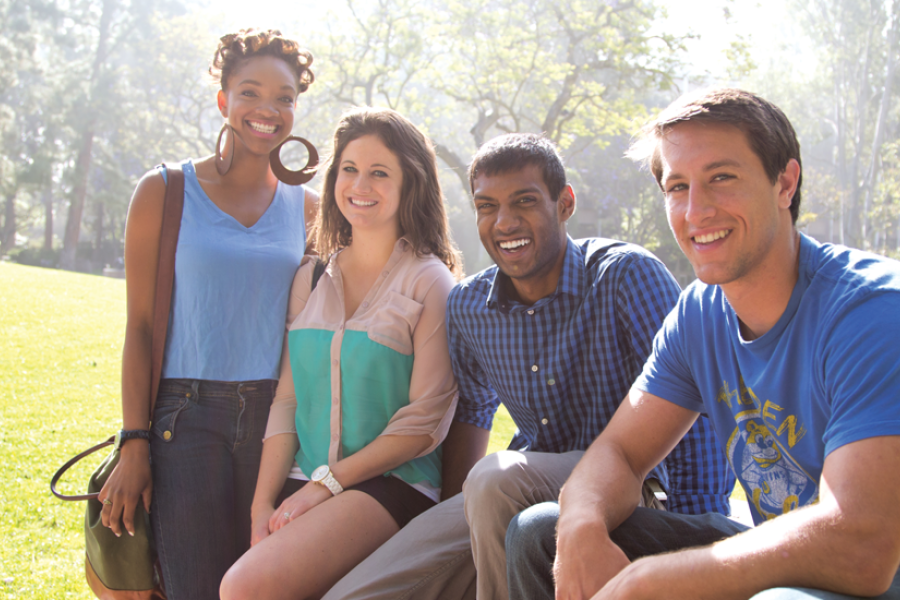 External shot at UCLA of students gathered together smiling