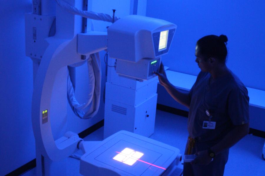 Tech with radiology equipment